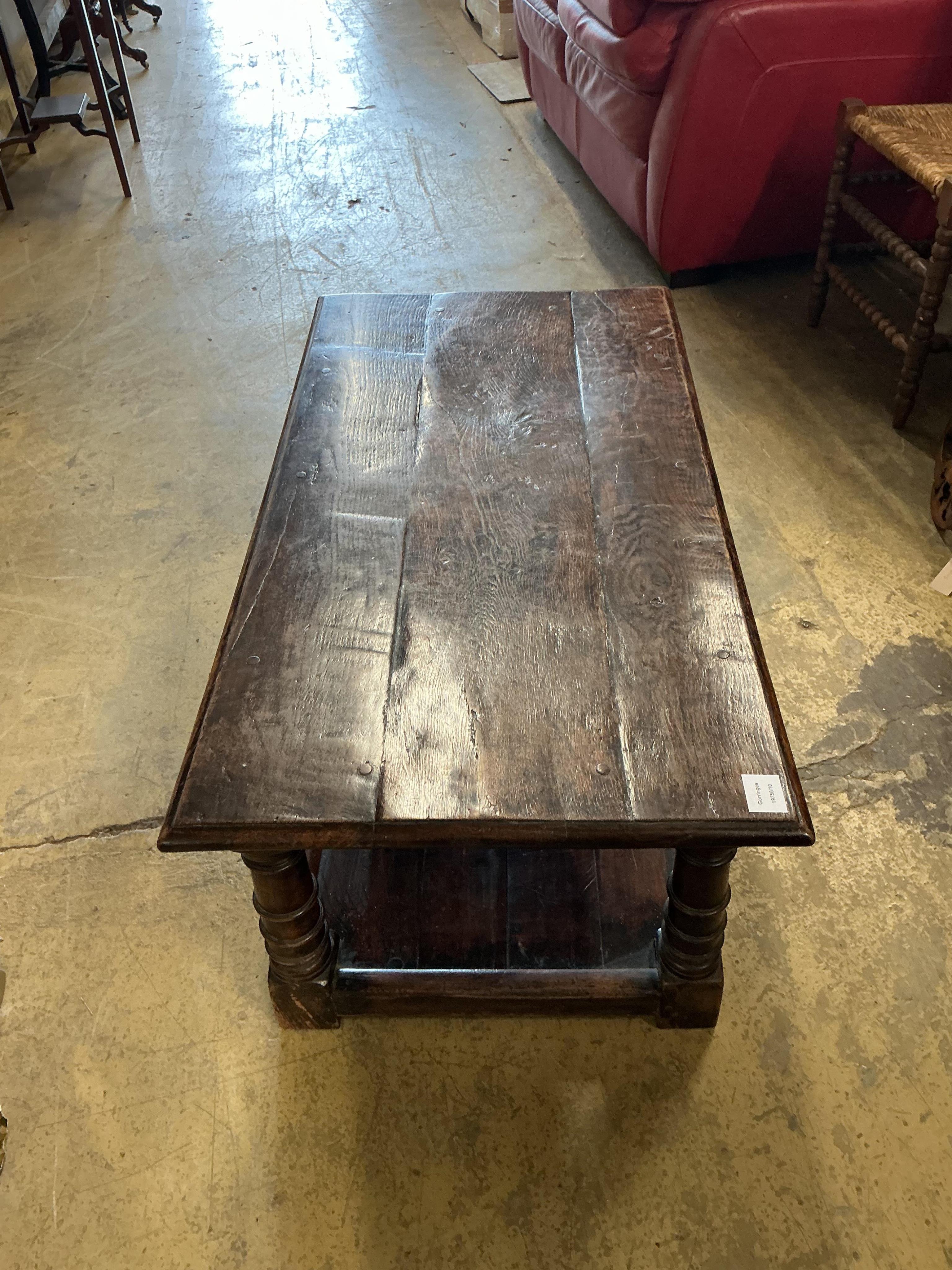 A 17th century style rectangular oak two tier coffee table, width 106c, depth 55cm, height 43cm